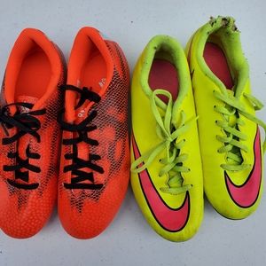 Two pair of kids cleats